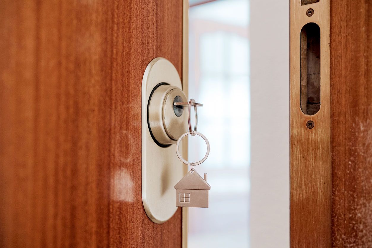 A key attached inserted in an open door
