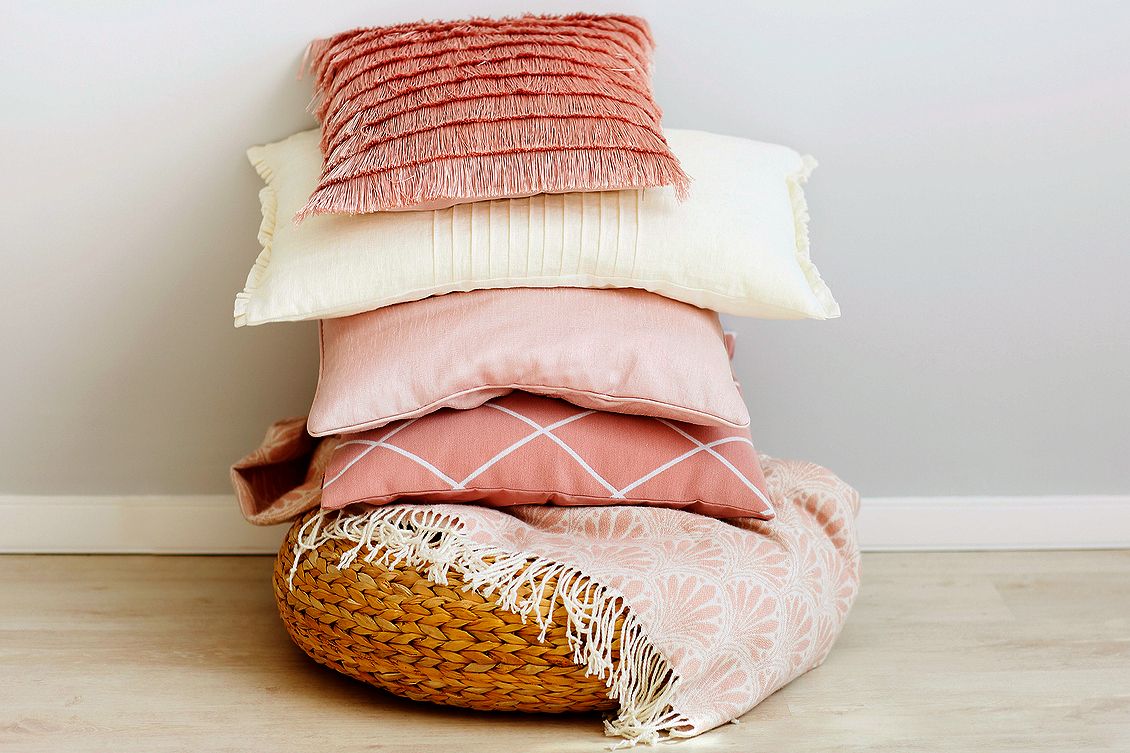 An image of a pile of pillows in a basket