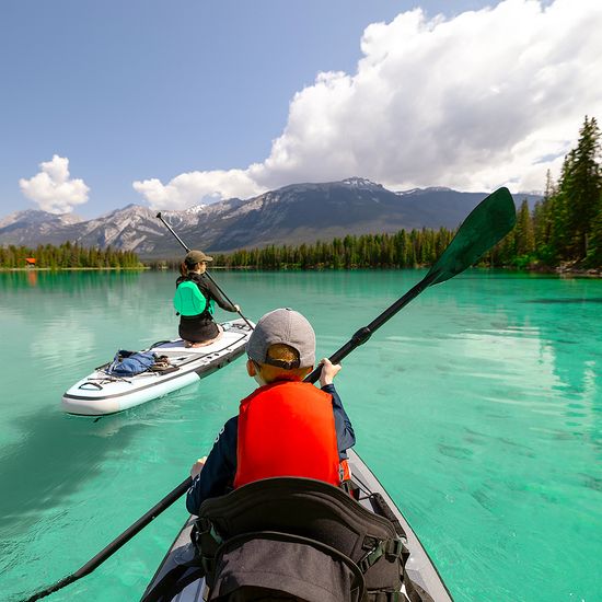 An image of two people canoeing