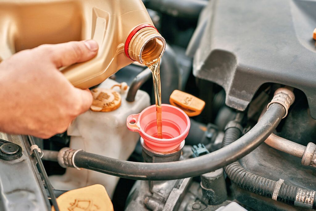 Pouring oil into an engine