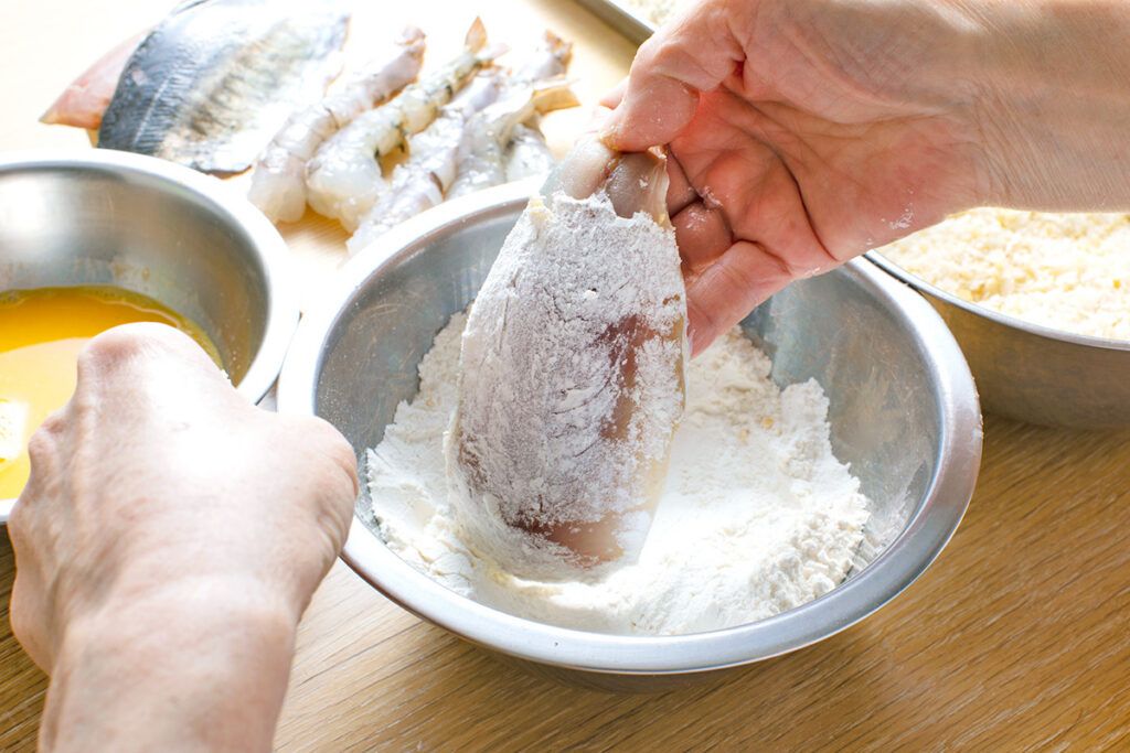 Dredging fish in flour