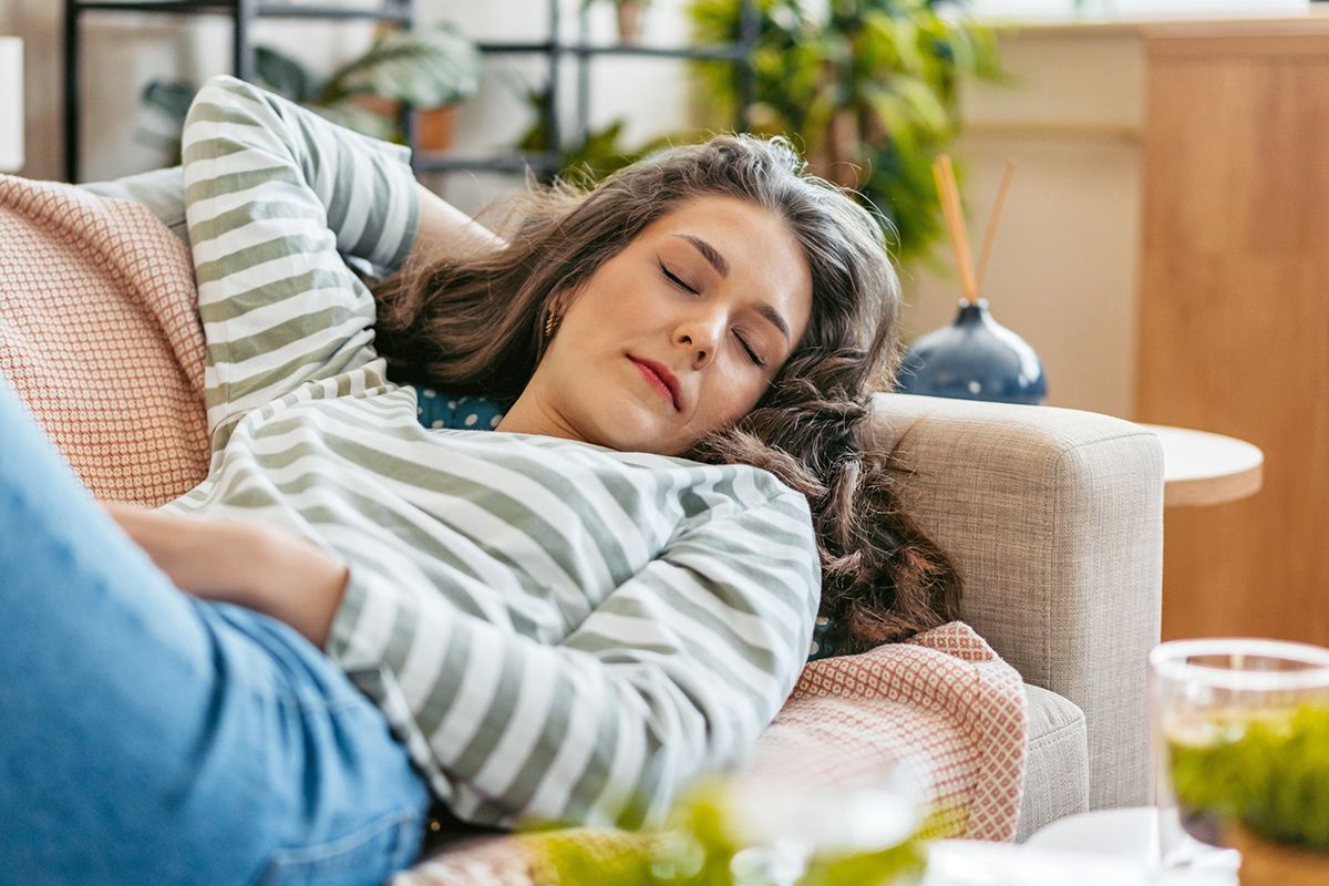 Woman napping on couch