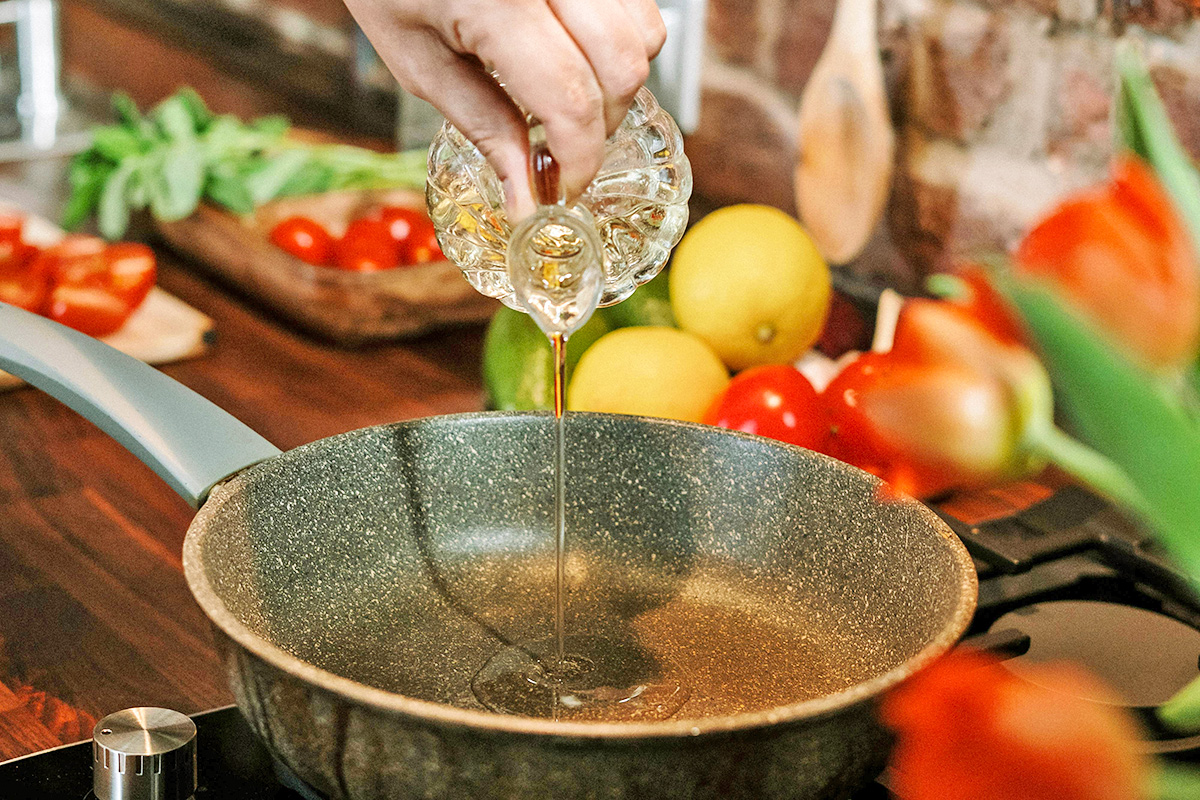 Pouring oil into pan
