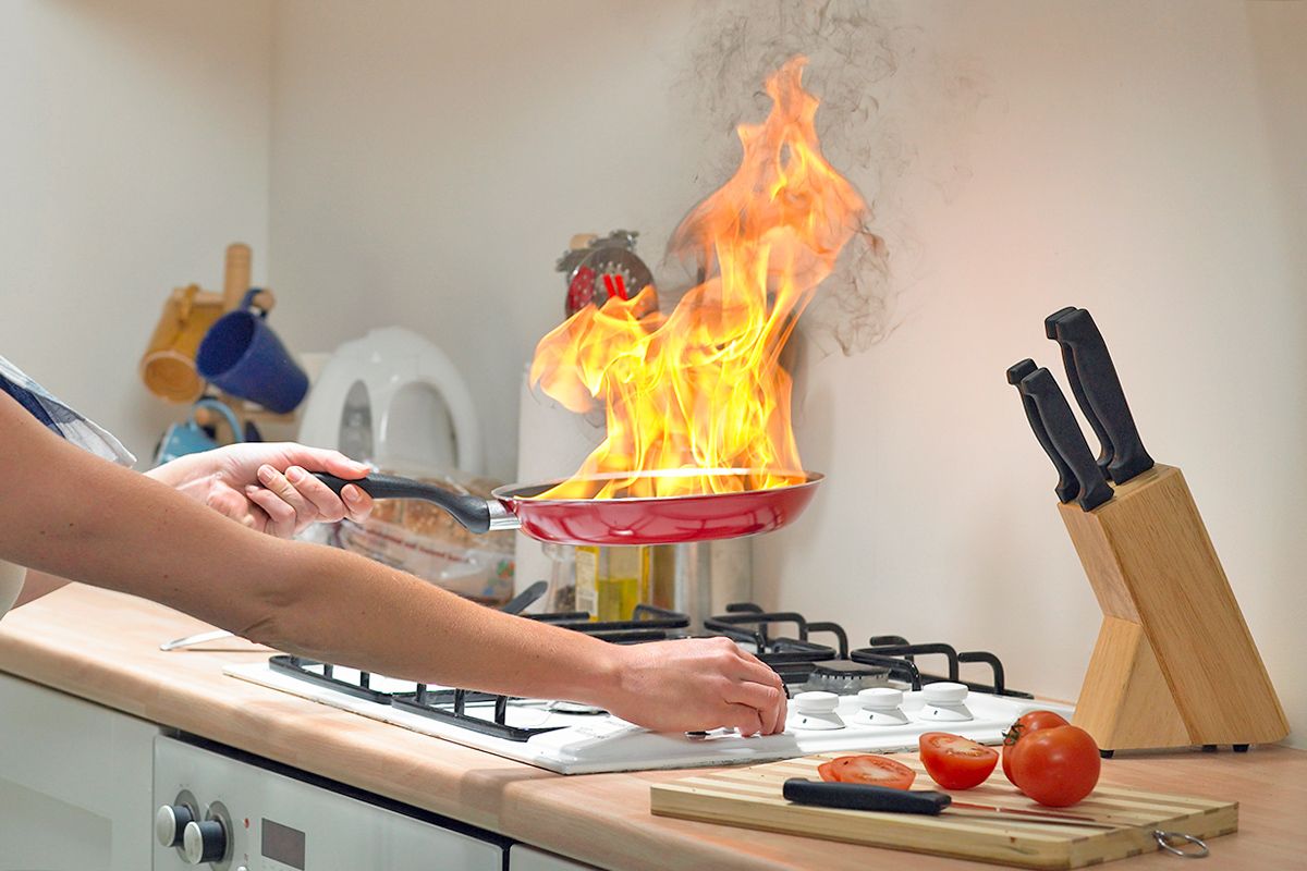 fire in a pot on a stove