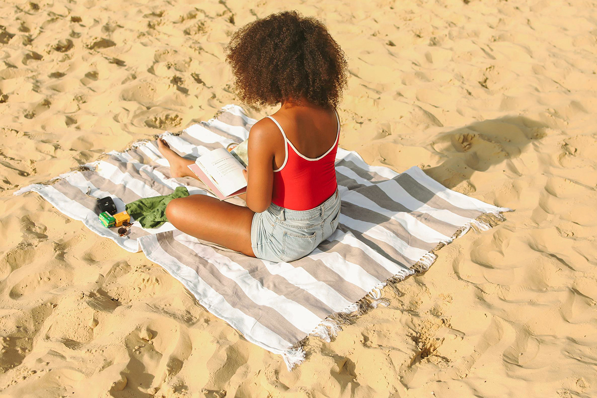 Woman reading at beach