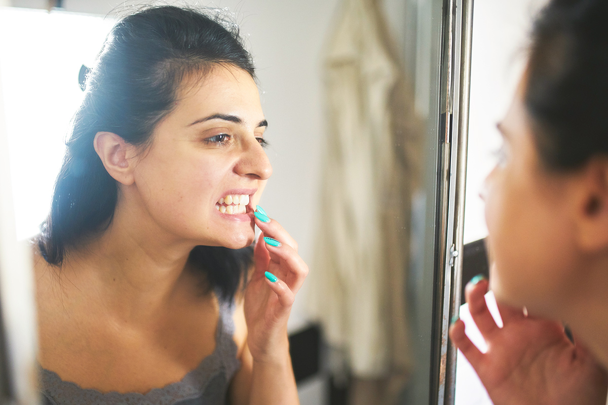 Woman looking at teeth