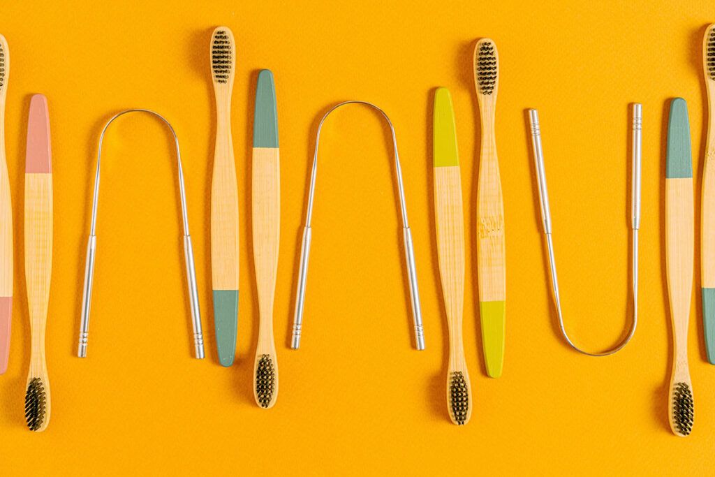 Tongue scrapers and toothbrushes