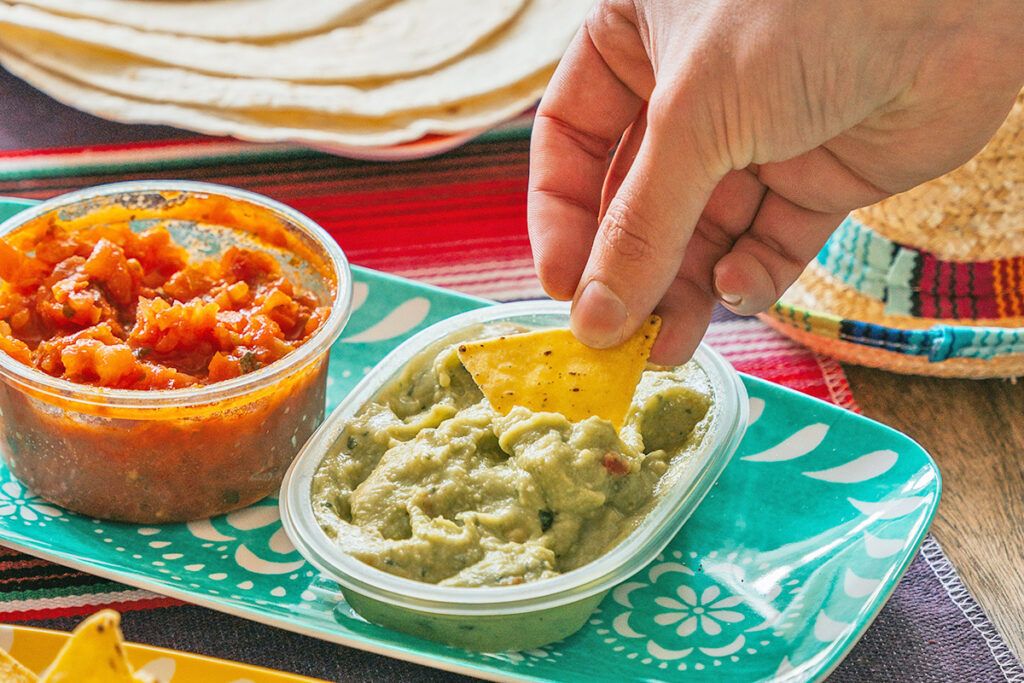 Dipping a chip in guacamole