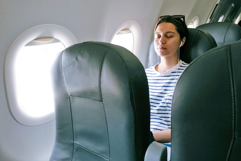 Woman sleeping on plane