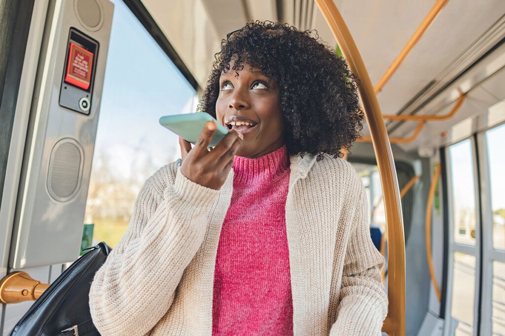 Woman using speakphone on a bus