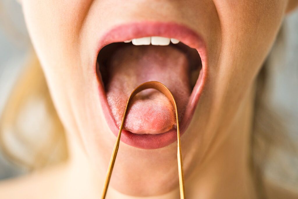 Tongue scraper on tongue