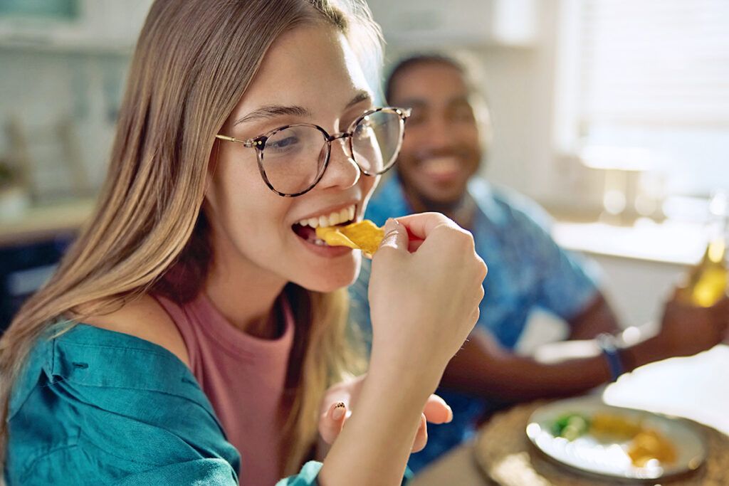 Woman eating a chip