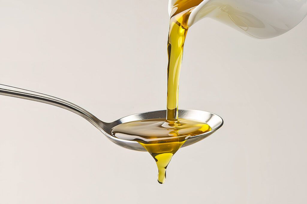 Oil into a spoon
