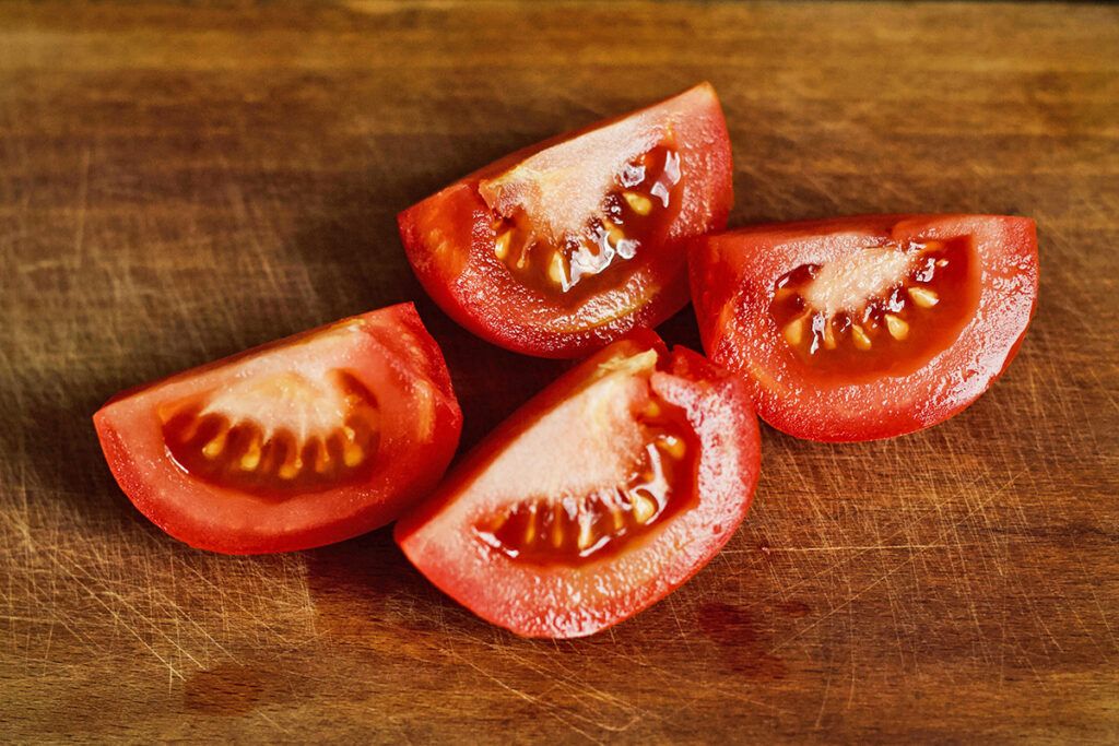 Cut tomatoes on a cutting board