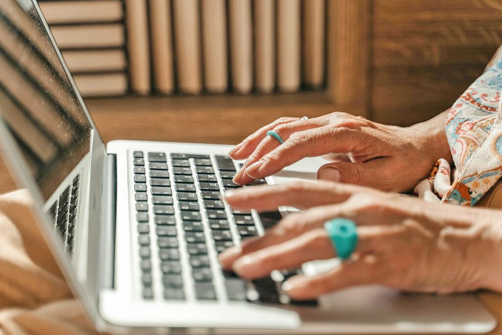 Person typing on computer