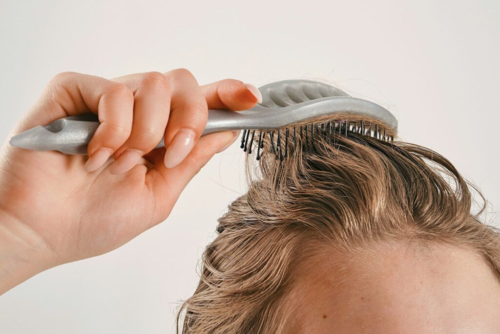 Person brushing hair