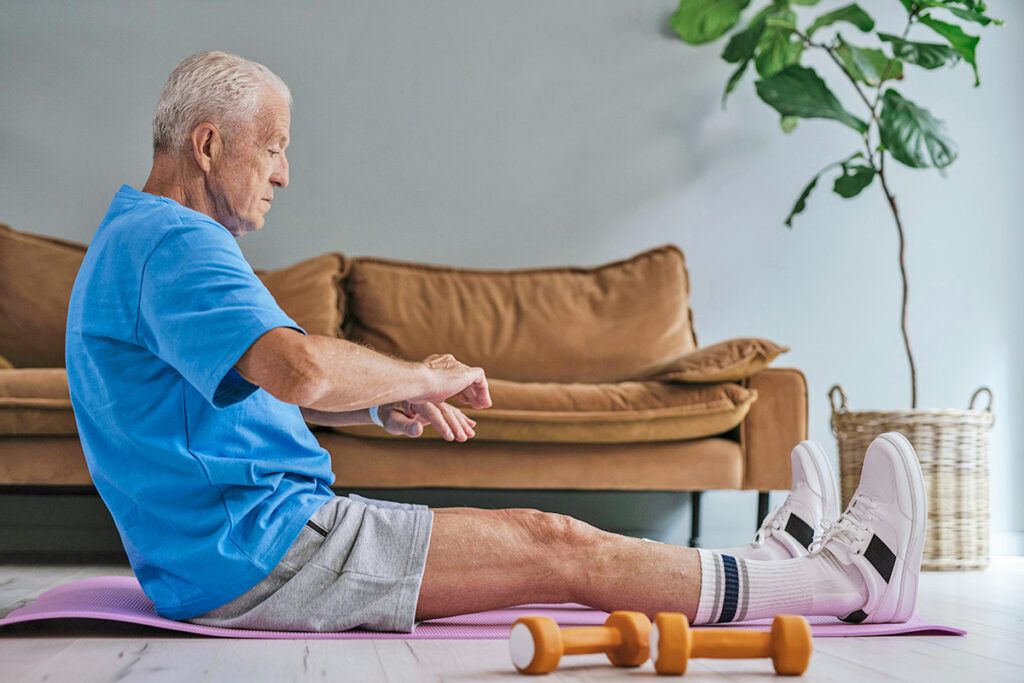 Older man working out at home