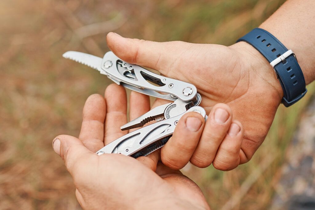 Person holding multitool