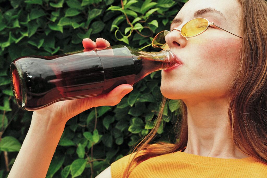 Woman drinking a soda