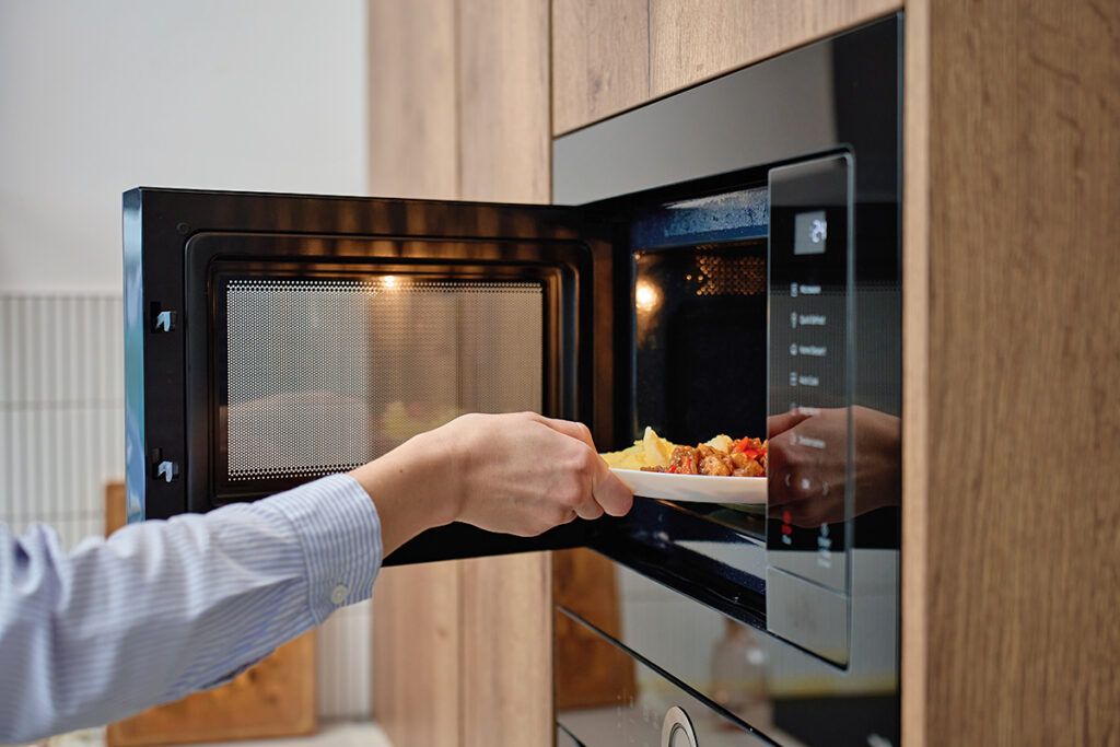 Putting food in microwave