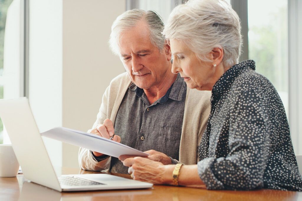 Older couple reviewing papers
