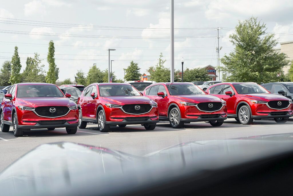 Cars in a car dealership parking lot