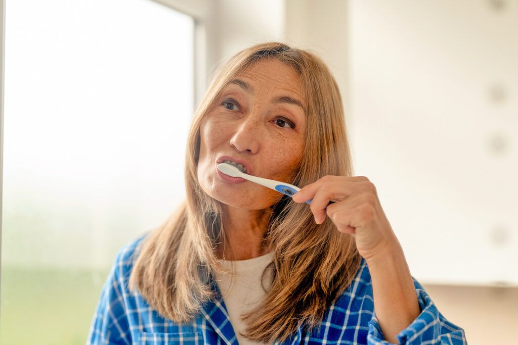 Woman brushing teeth