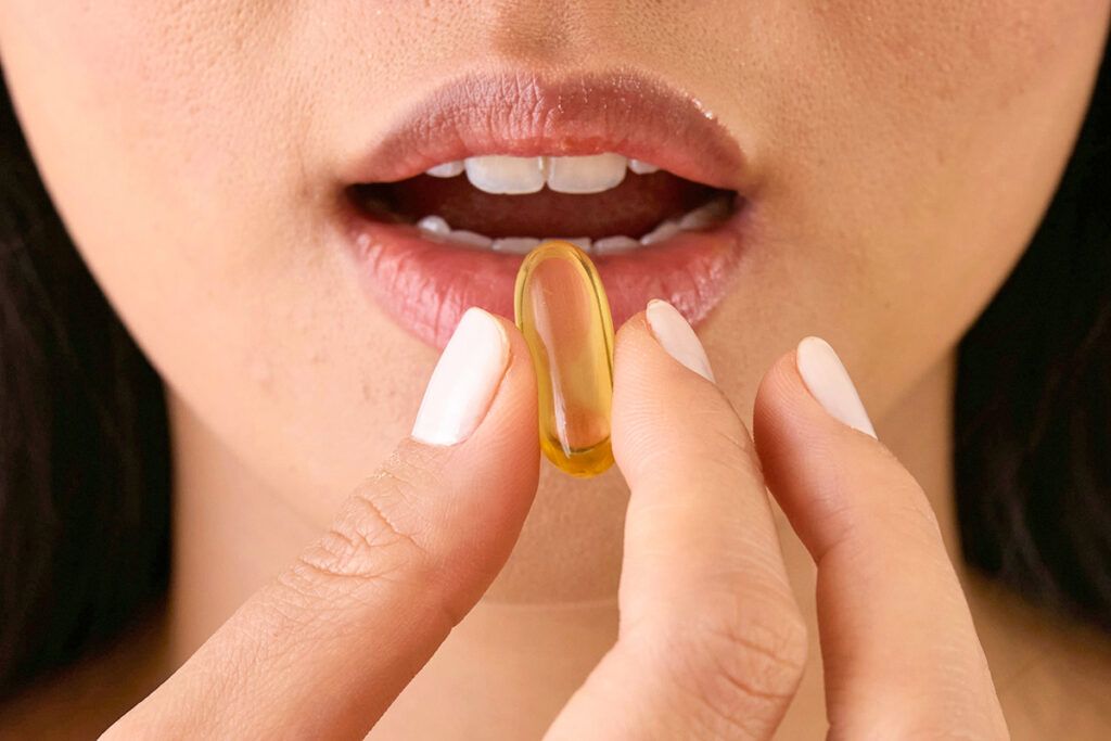 Pill in front of open mouth