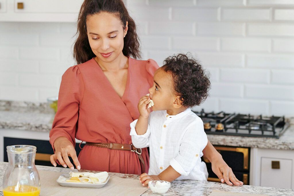 Mother and toddler in kitchen