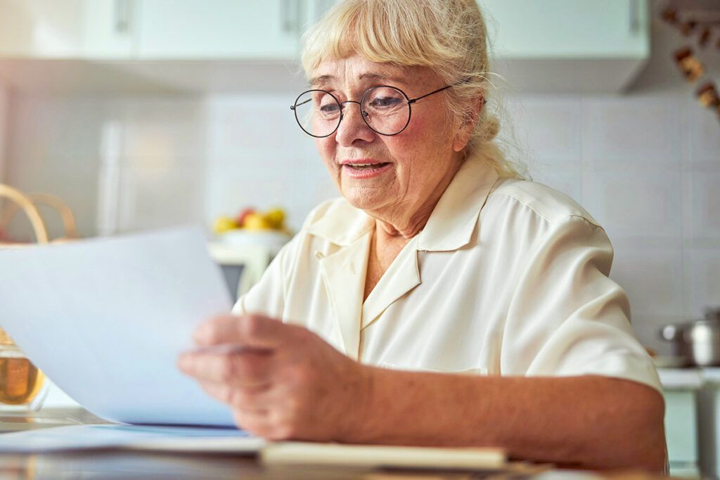 Older woman looking at paperwork