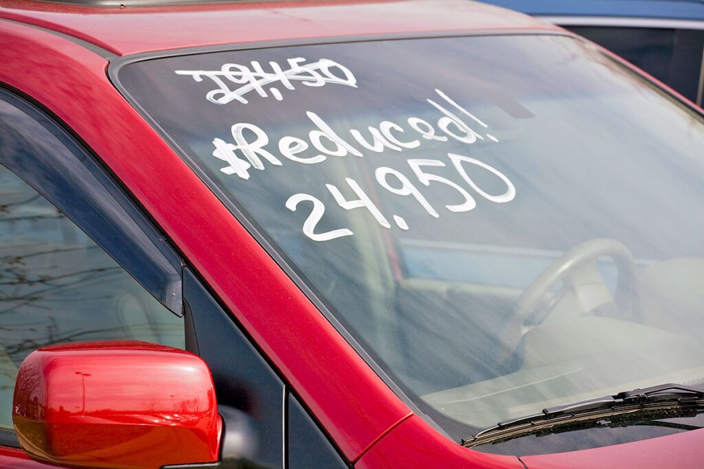 Car with sale price on windshield