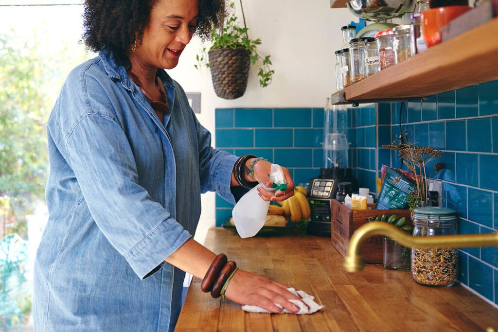 Woman cleaning counter