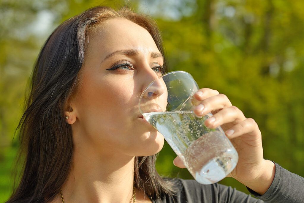Woman drinking sparkling water