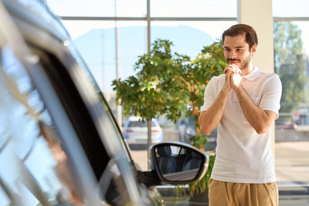 Man looking at a car