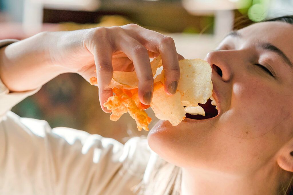Woman eating chips
