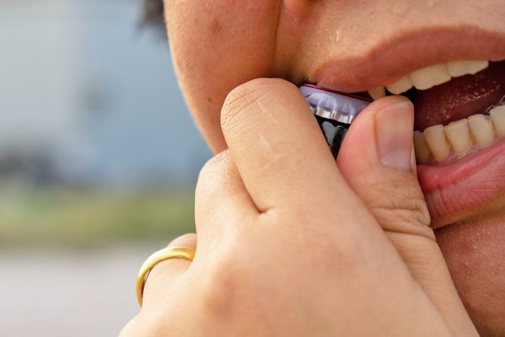 Opening bottle with teeth