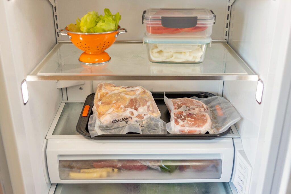 Frozen food thawing in fridge
