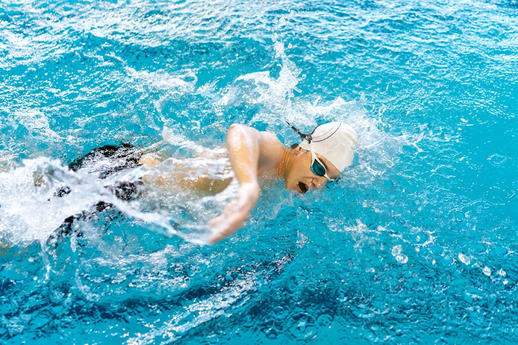 Person swimming in pool