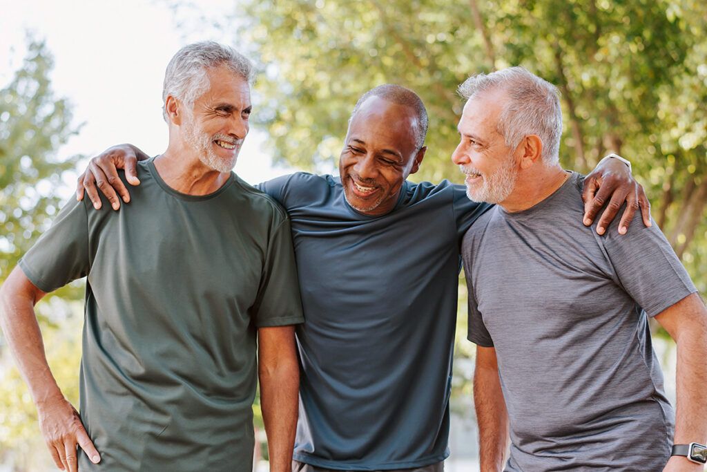 Three older men in a park