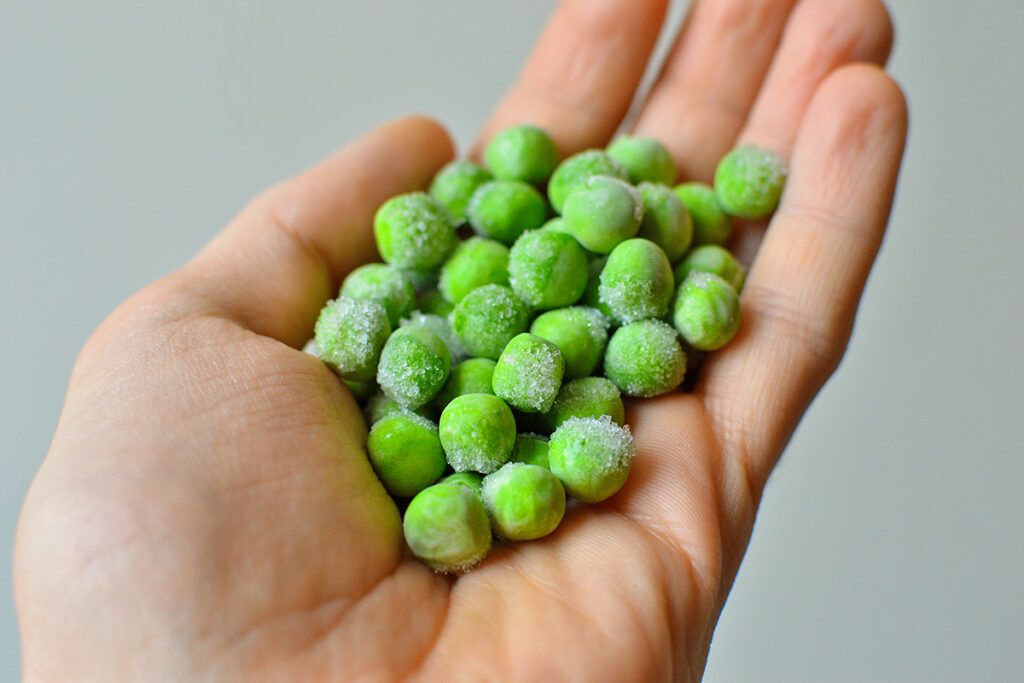 Frozen peas in hand