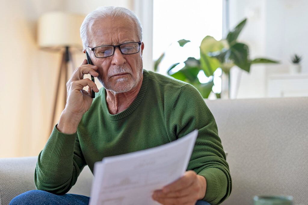 Man on phone looking confused