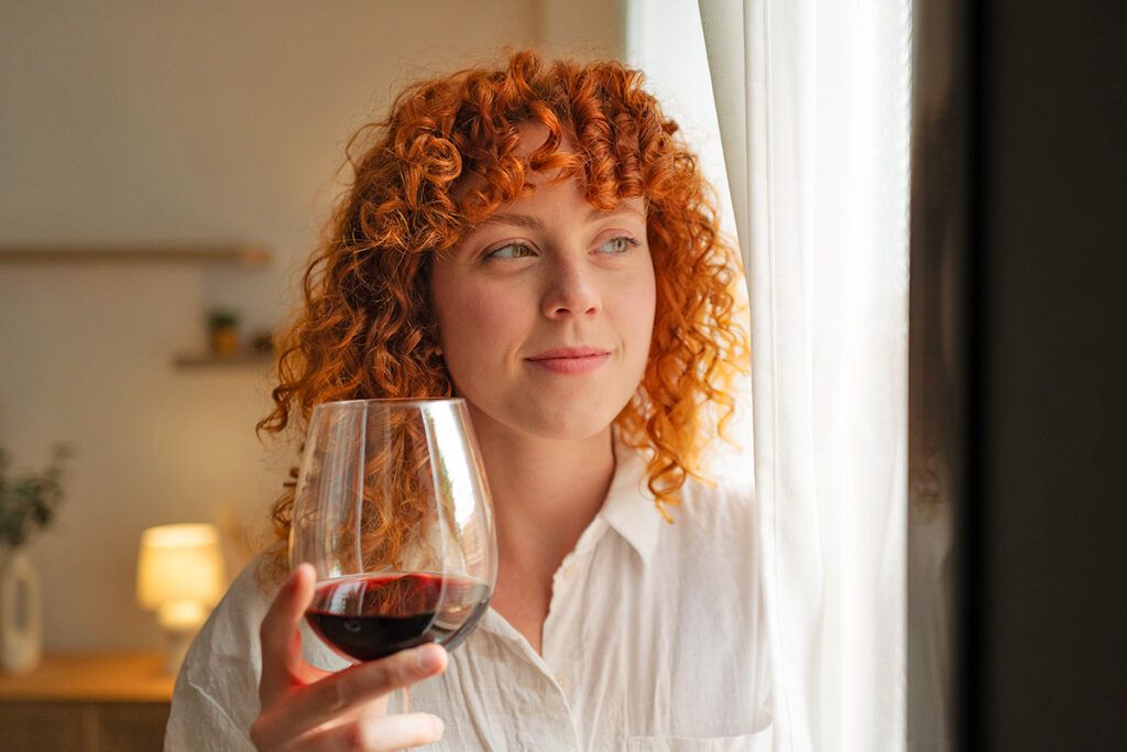 Woman with glass of wine