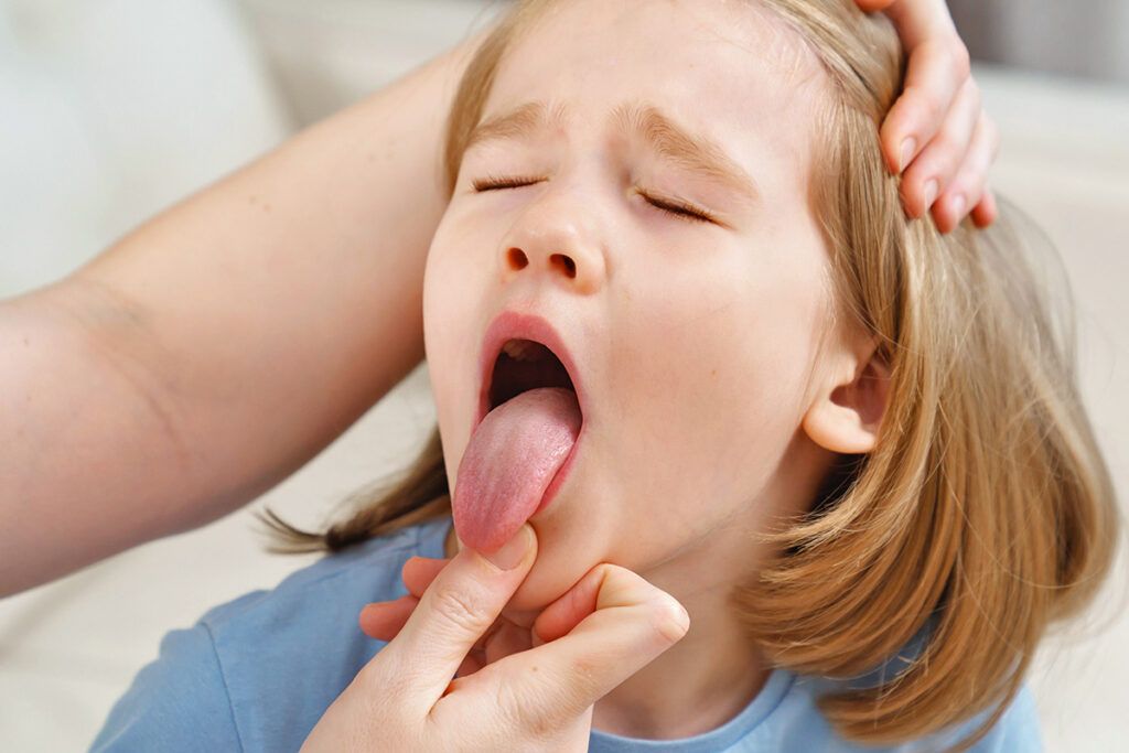 Little girl sticking out tongue