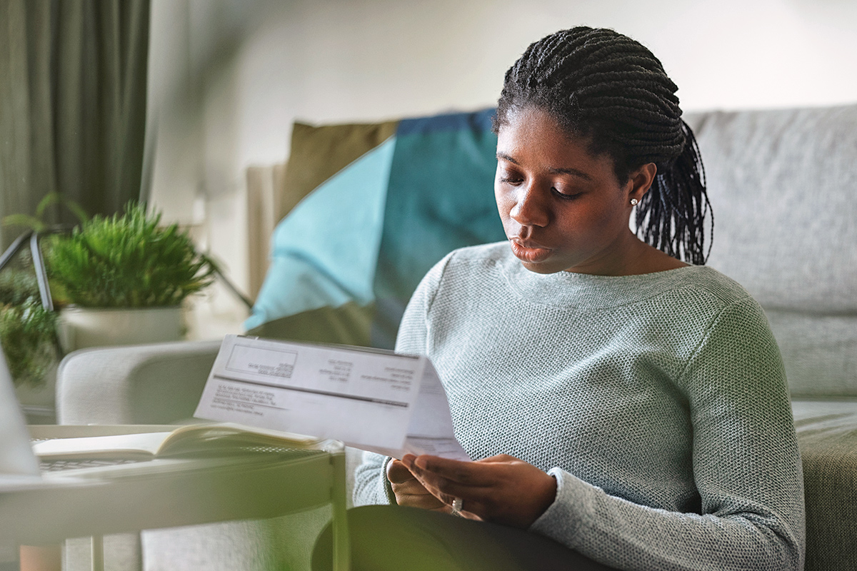 Woman looking at electricity bill