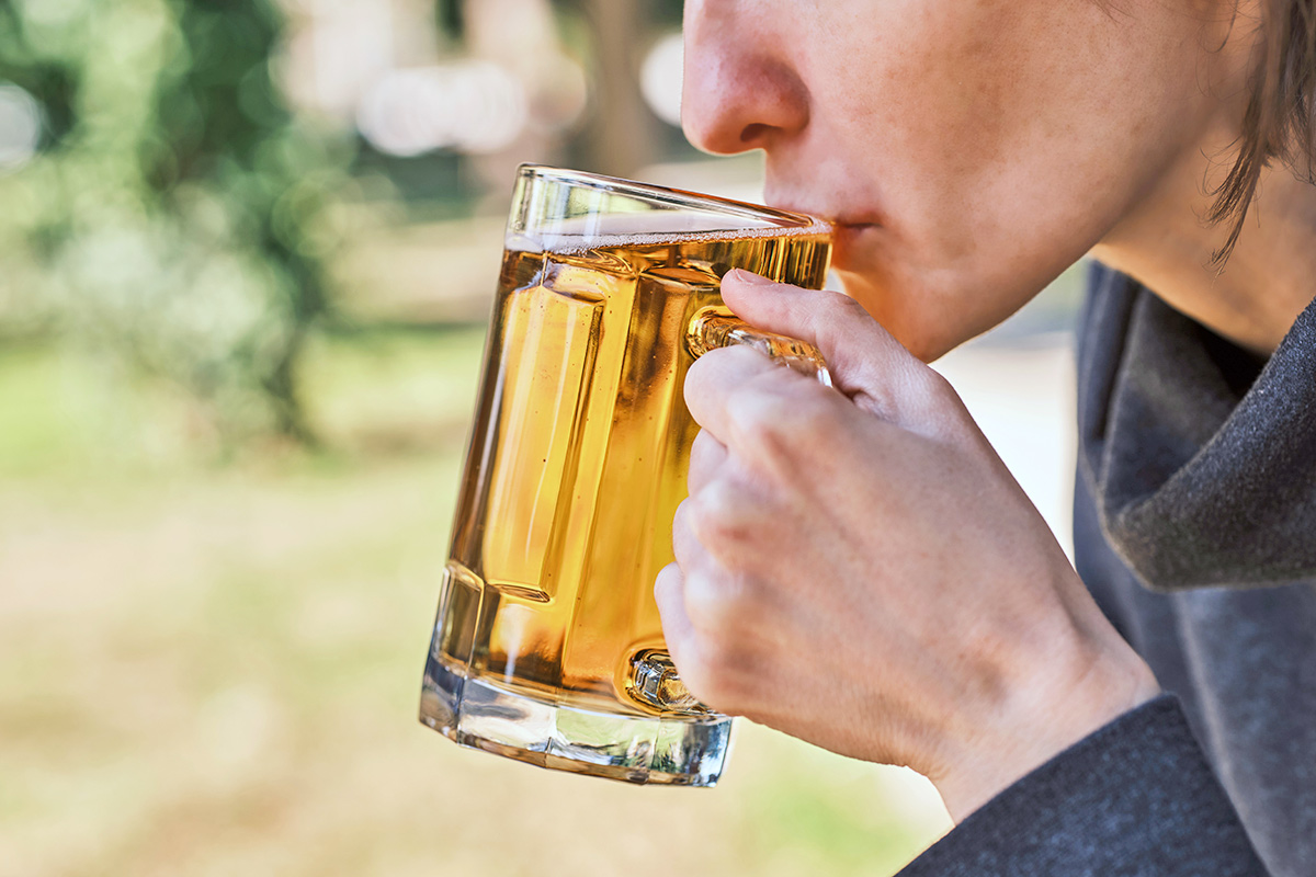 Person sipping beer