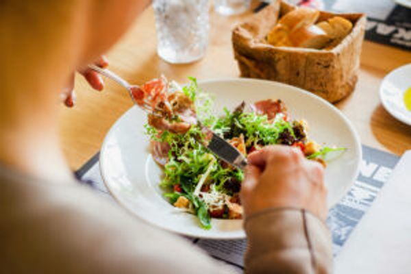 Person eating salad