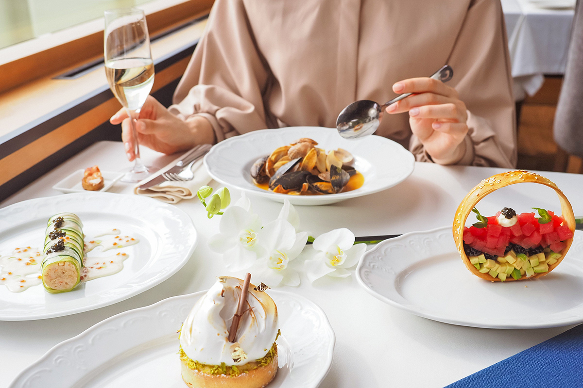 Person eating food at restaurant