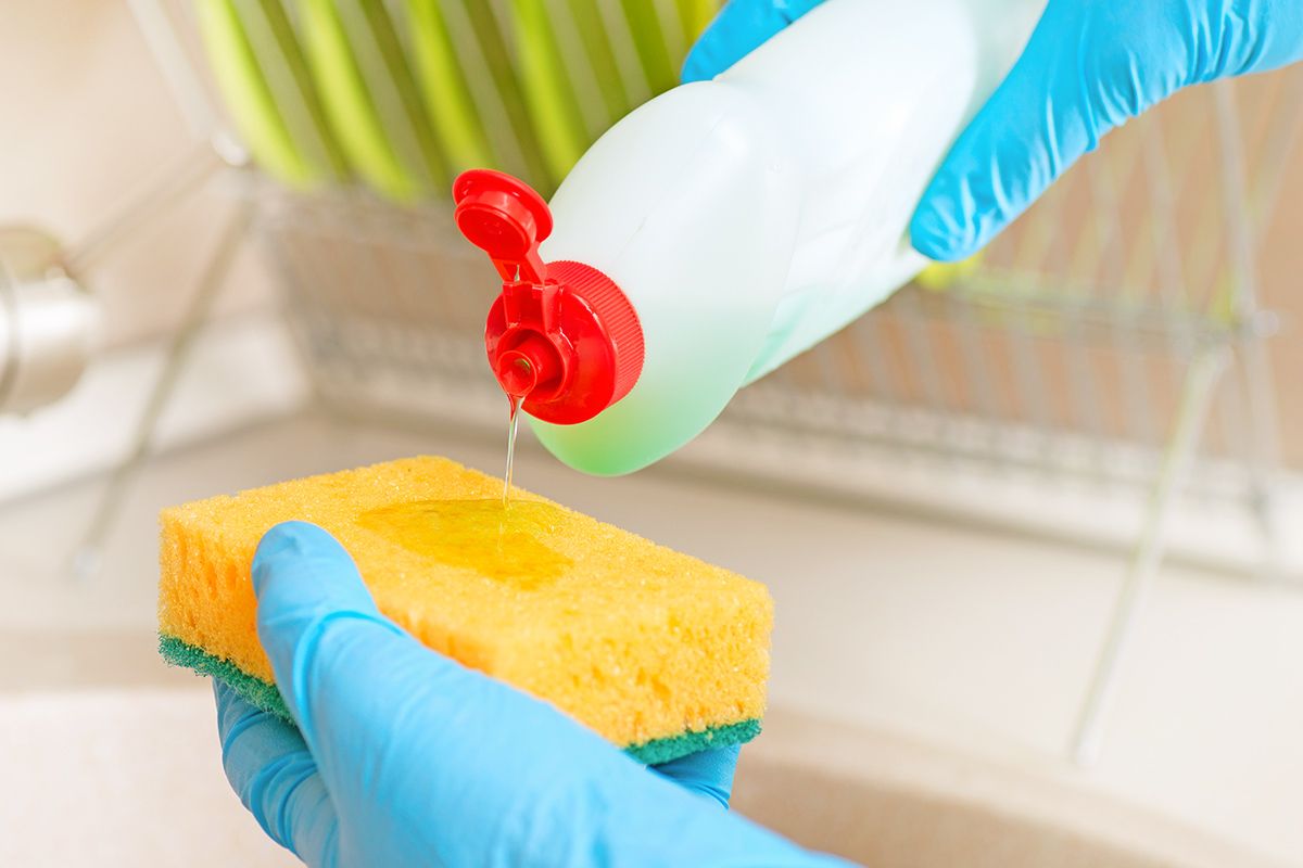 Putting soap on sponge