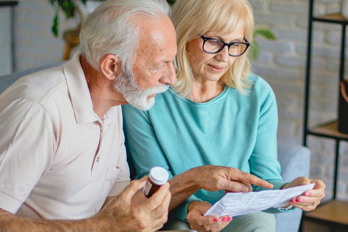 Senior couple looking at bill