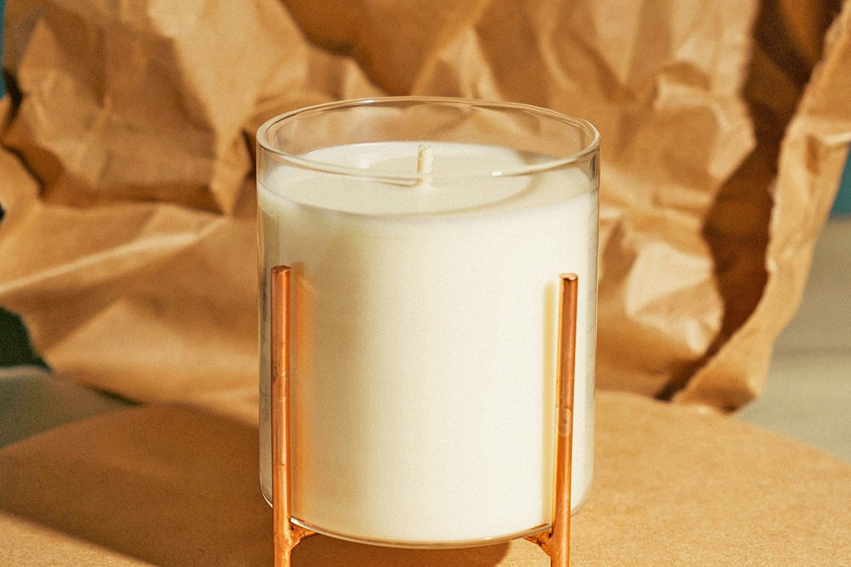 Unlit candle in glass container